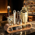 Set of cocktail-making tools on a wooden stand with a bar setting in the background