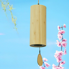 Wooden wind chime with a blue sky and cherry blossoms in the background