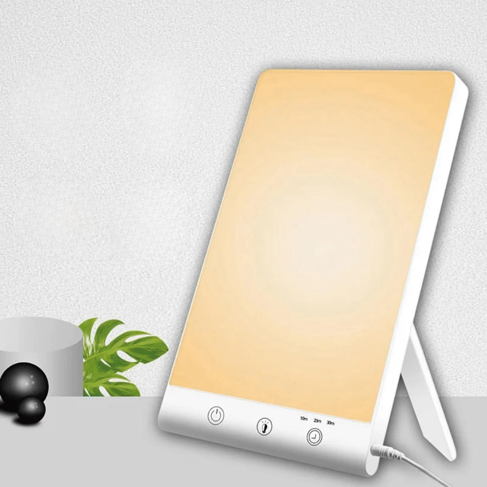 Light therapy lamp with a gradient design on a white surface