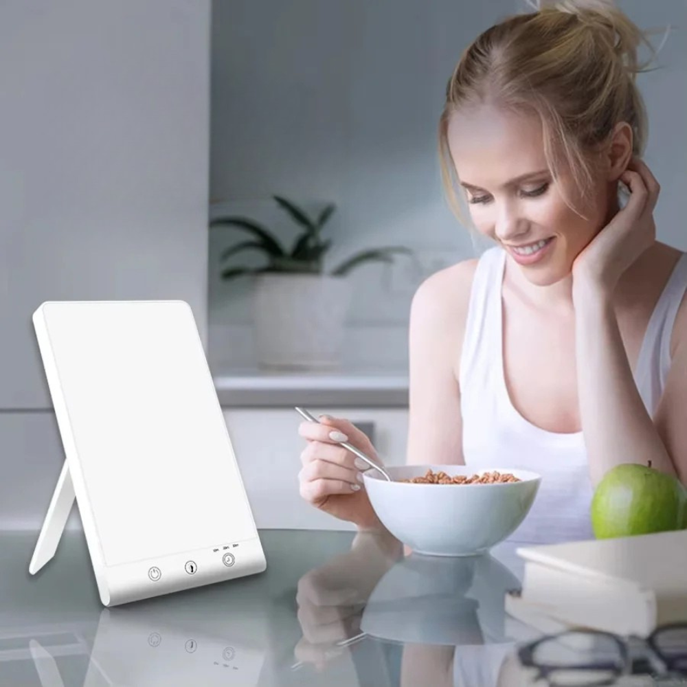 Woman eating cereal with a white lamp on a table in a kitchen setting