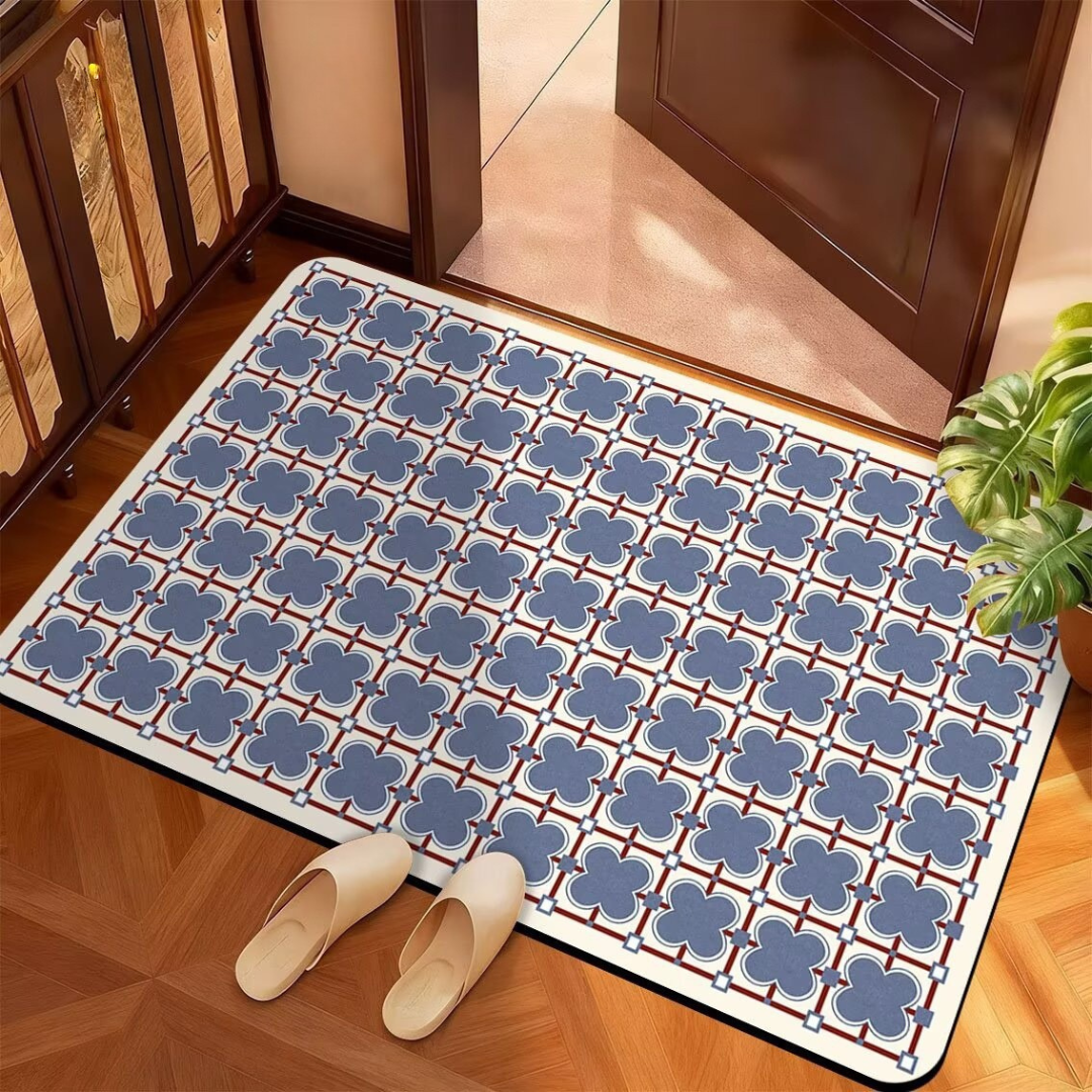 Decorative doormat with floral pattern on a wooden floor