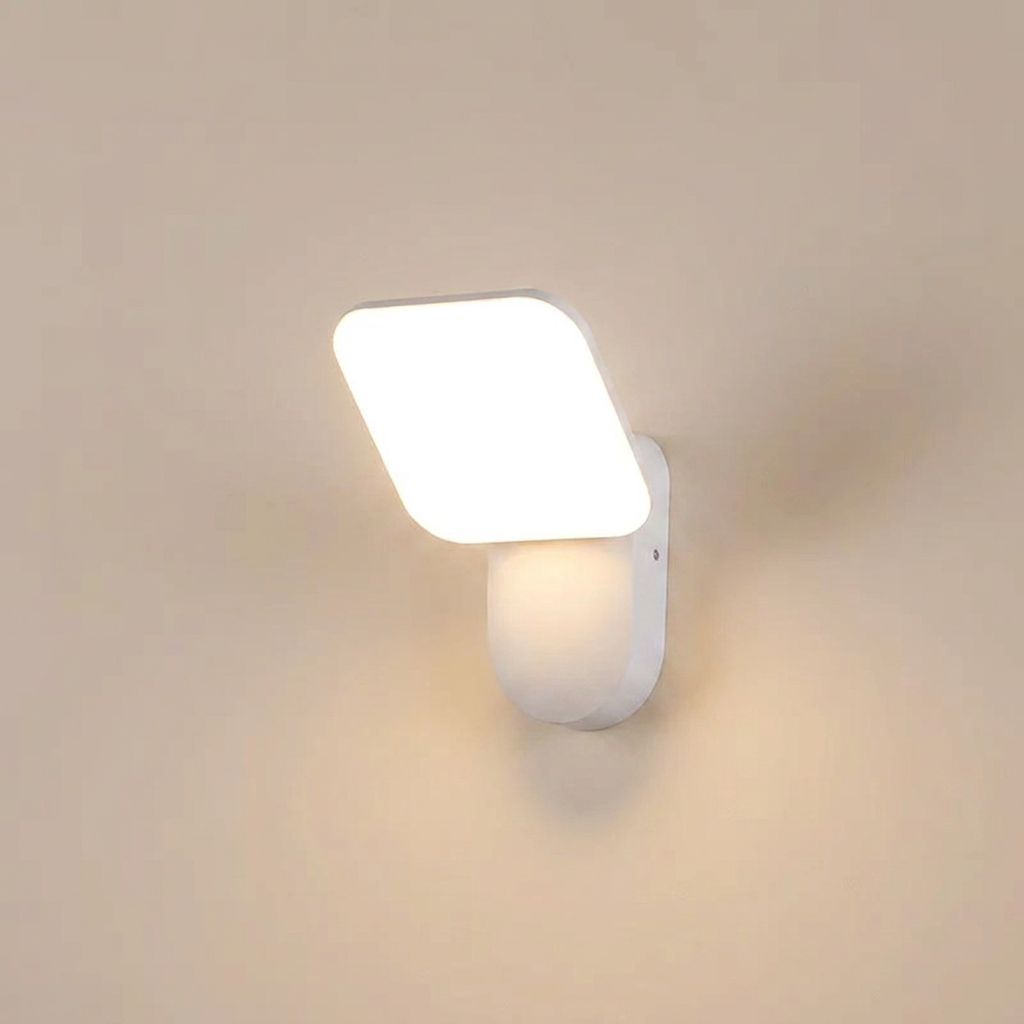 Modern wall-mounted light fixture on a beige wall