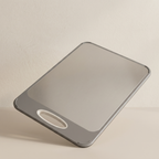 Phone case with a reflective surface on a beige background