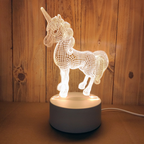 Unicorn-shaped night light on a wooden surface