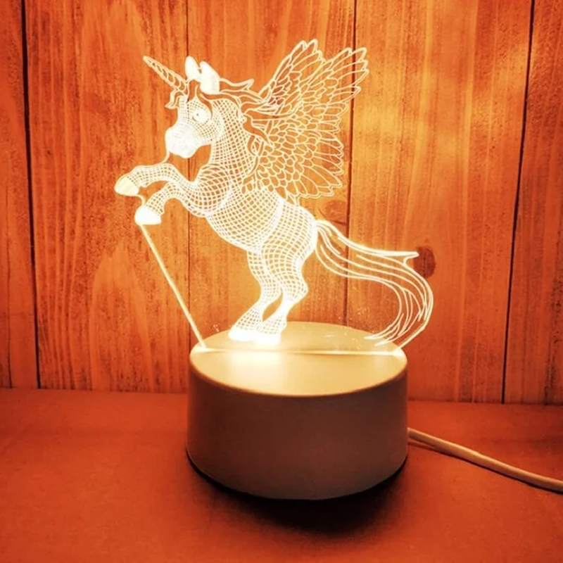Unicorn-shaped night light on a wooden surface