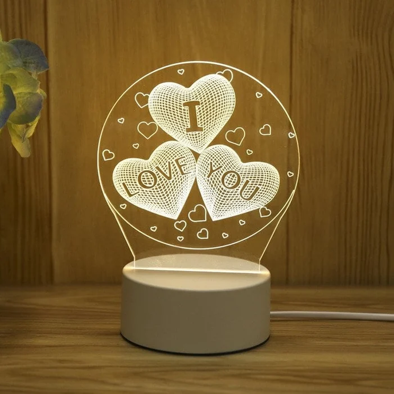 Decorative night light with 'I LOVE YOU' text on a wooden surface