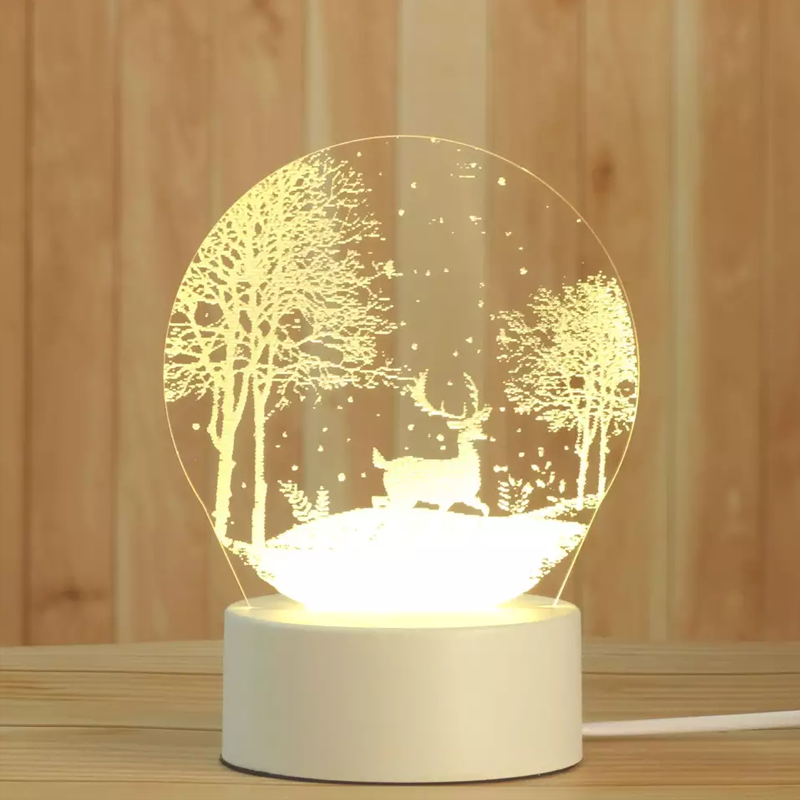 Decorative lamp with a deer in a forest design on a wooden surface