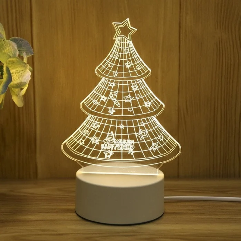 3D Christmas tree lamp on a wooden surface with a plant in the corner