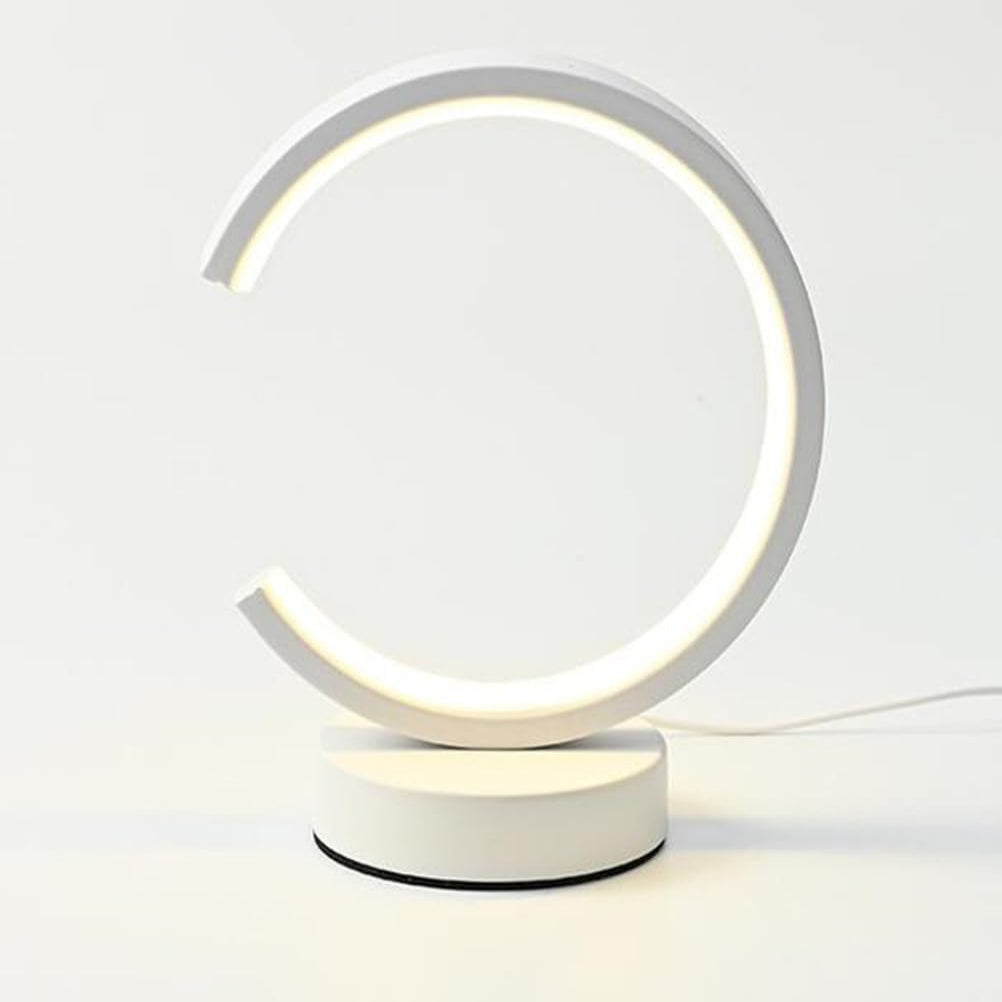 Modern table lamp with circular design on a white background