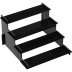 Black metal step stool with four tiers on a white background