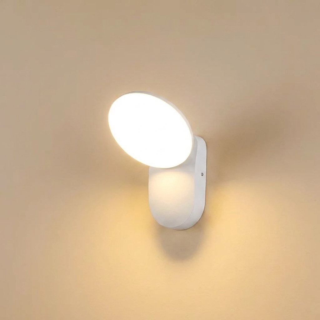 White wall-mounted light fixture on a beige wall