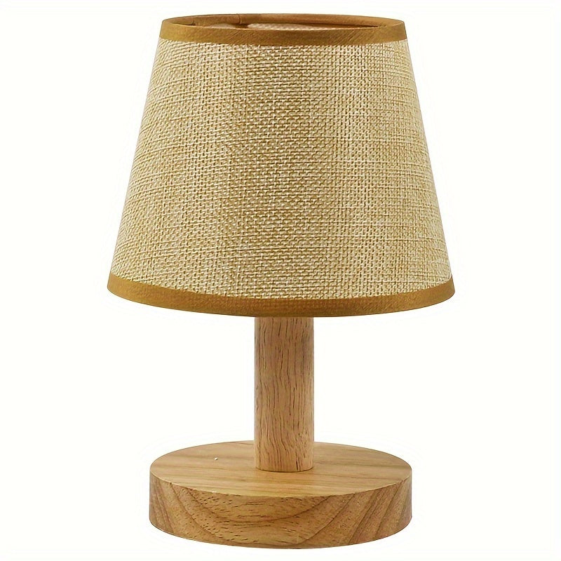 Wooden table lamp with a textured beige shade on a white background