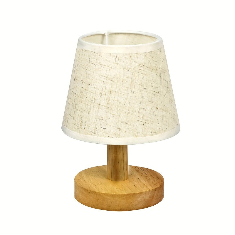 Table lamp with a woven shade and wooden base on a white background
