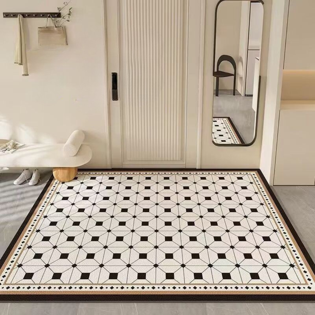 Geometric patterned rug in a room with a mirror and door.