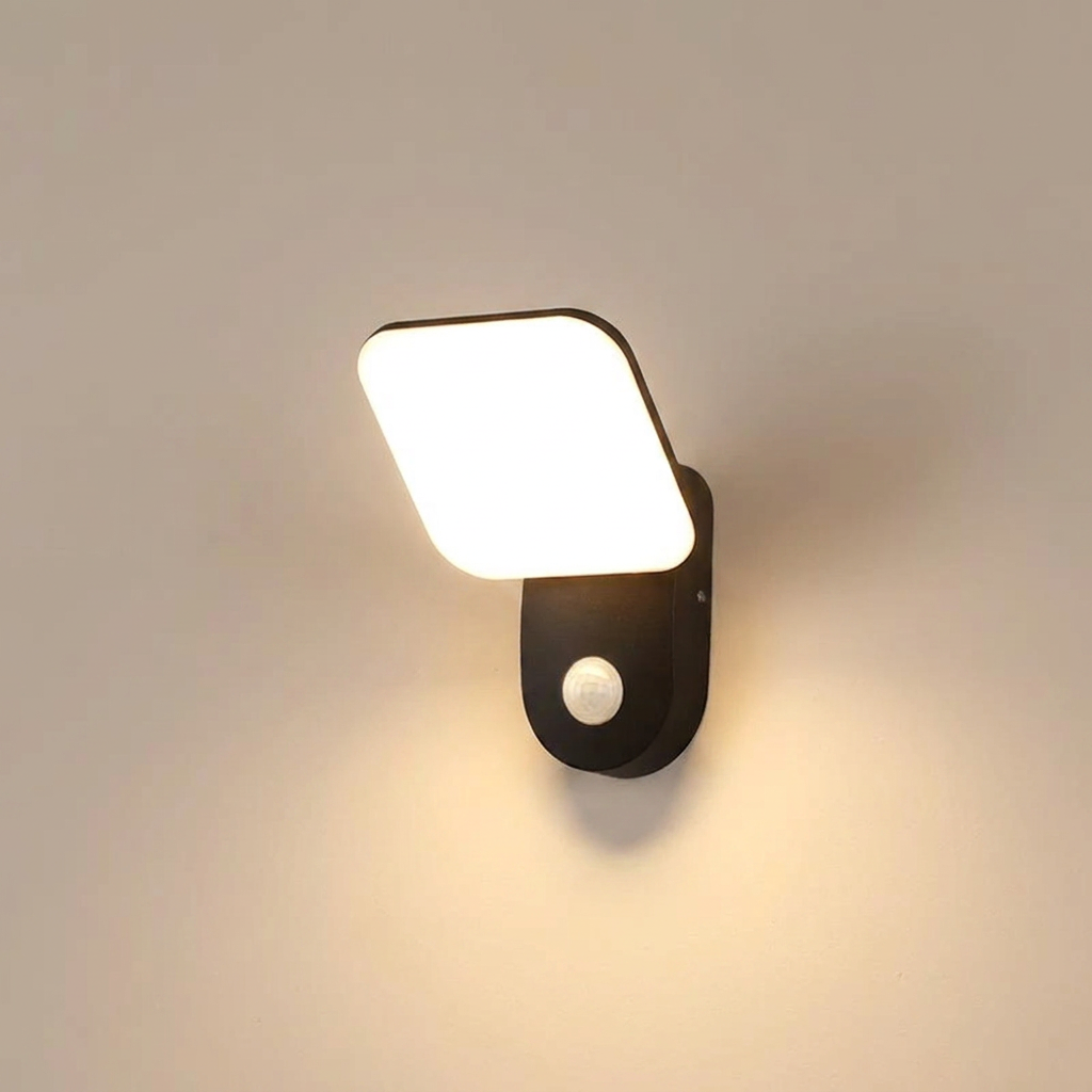 Wall-mounted light fixture with a square white light cover on a neutral background