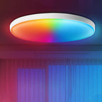 Ceiling light fixture with RGB color-changing lights in a room with curtains.