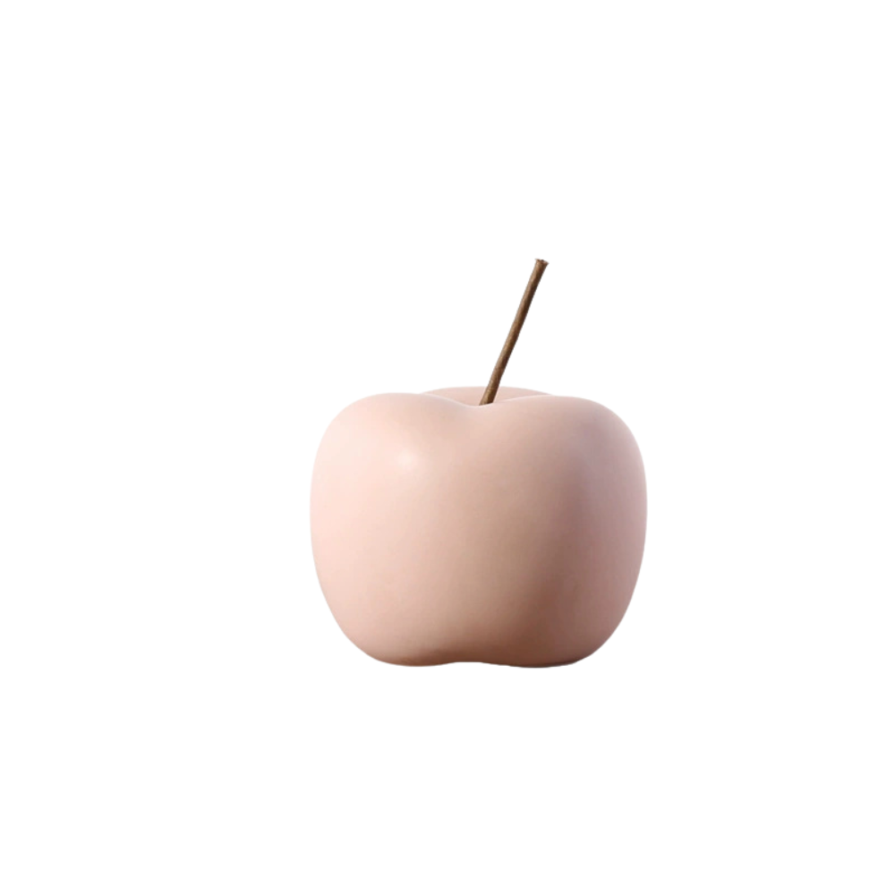 Pink apple-shaped object on a white background