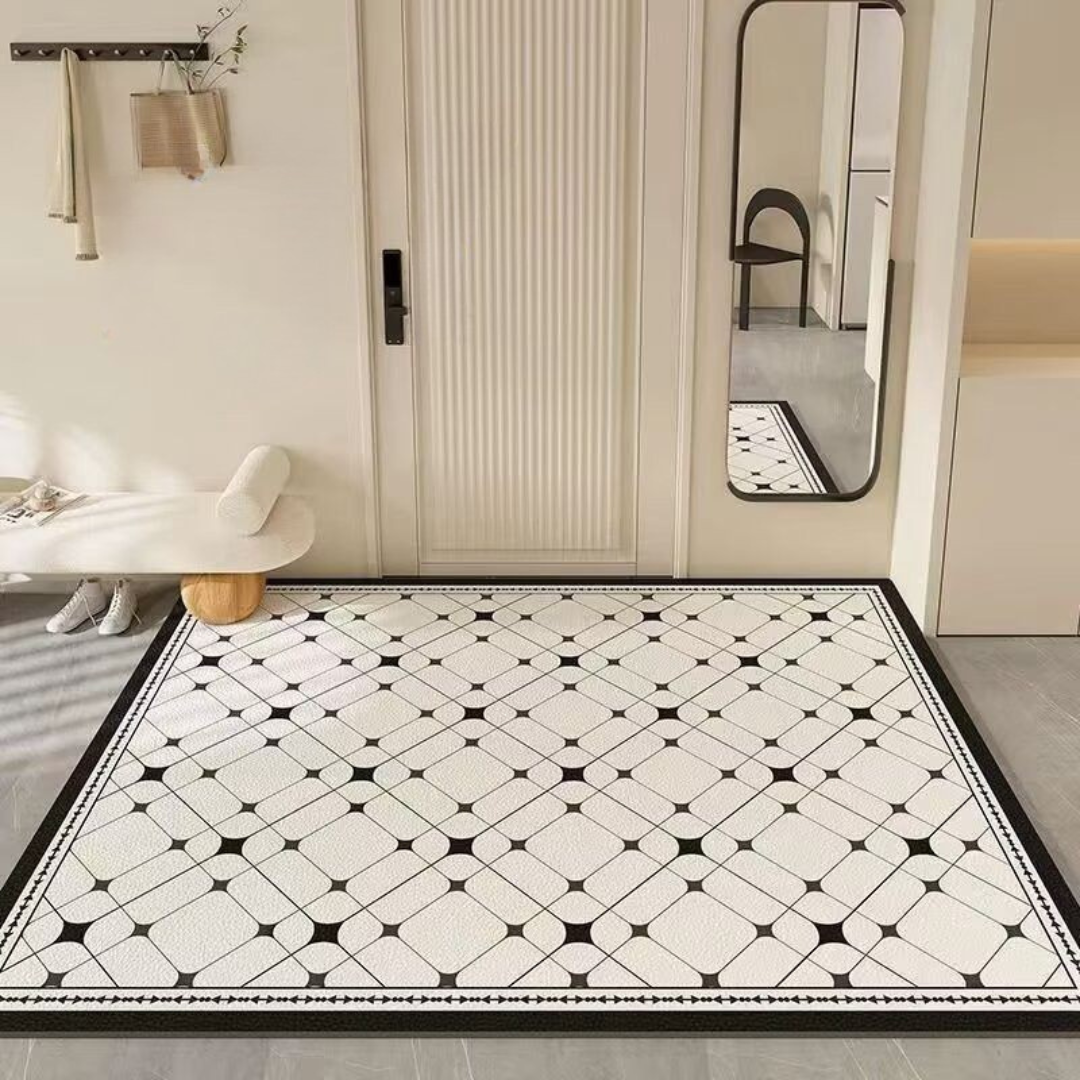Black and white patterned rug on a floor with a mirror and wall hooks in the background.