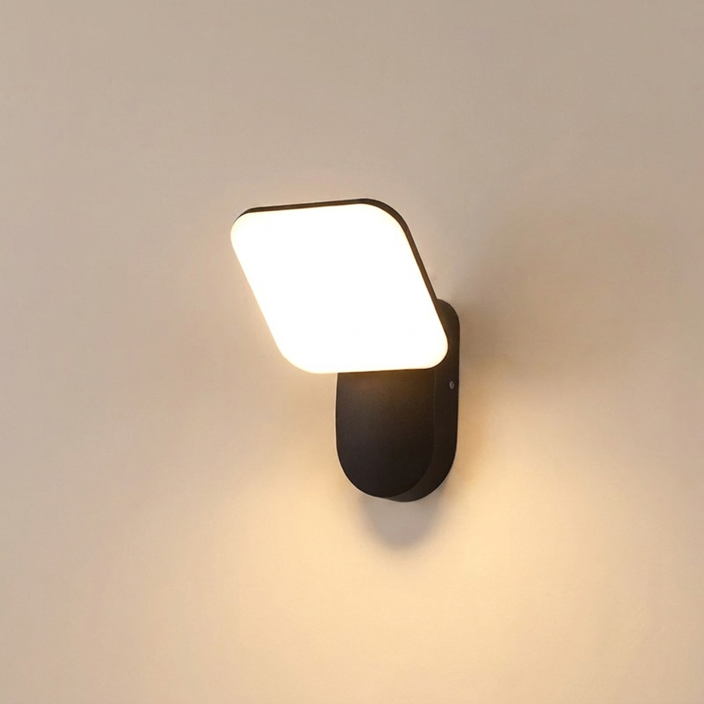 Wall-mounted light fixture with a square white lampshade on a beige wall.
