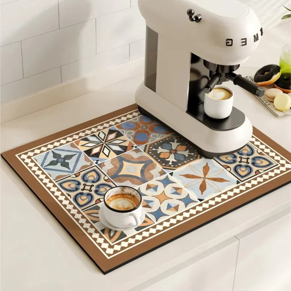 Decorative kitchen mat with geometric pattern next to a coffee machine and cups.