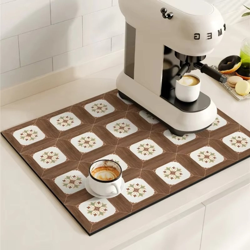 Kitchen scene with a coffee machine and cups on a decorative mat.