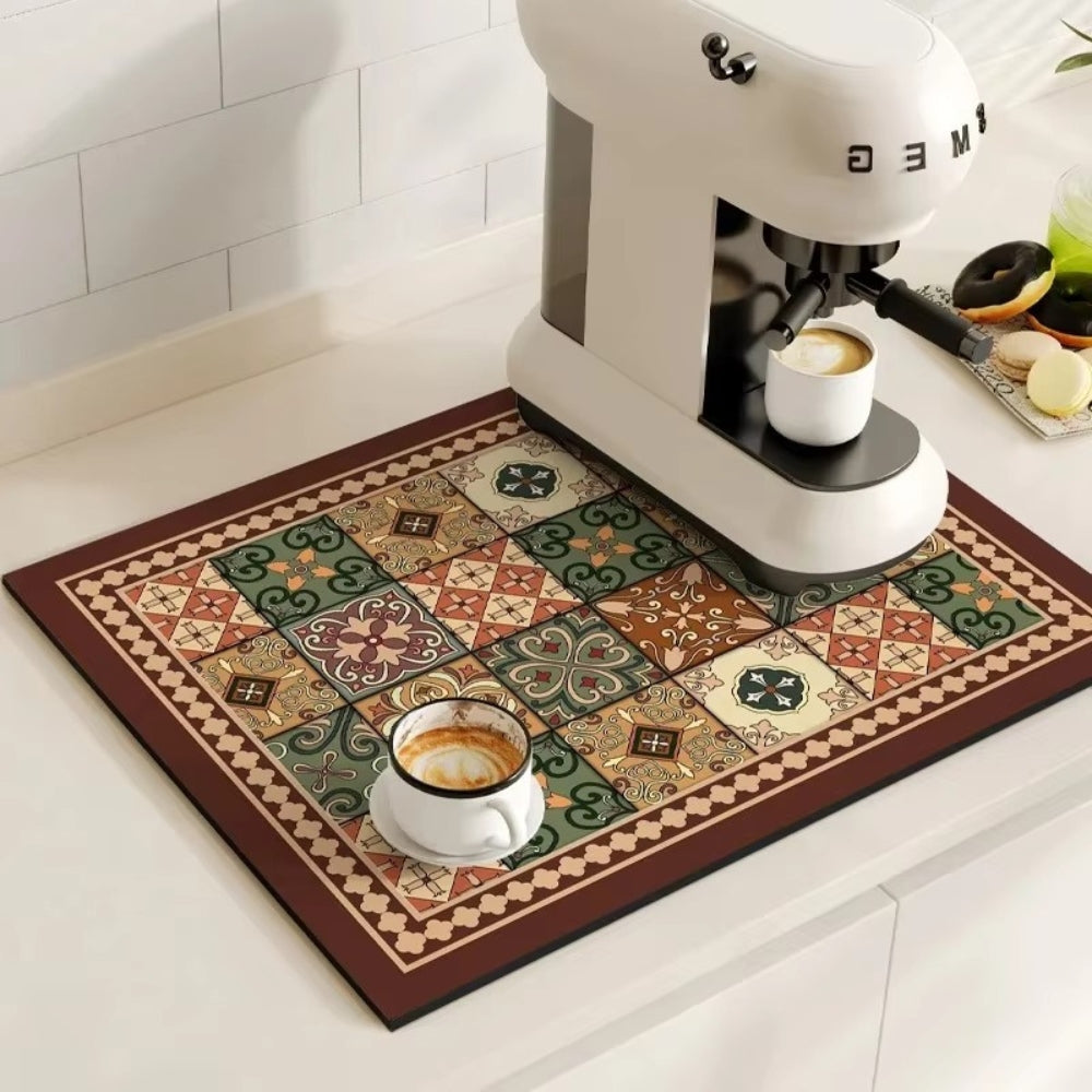 Espresso machine on a decorative mat with coffee cups in a kitchen setting