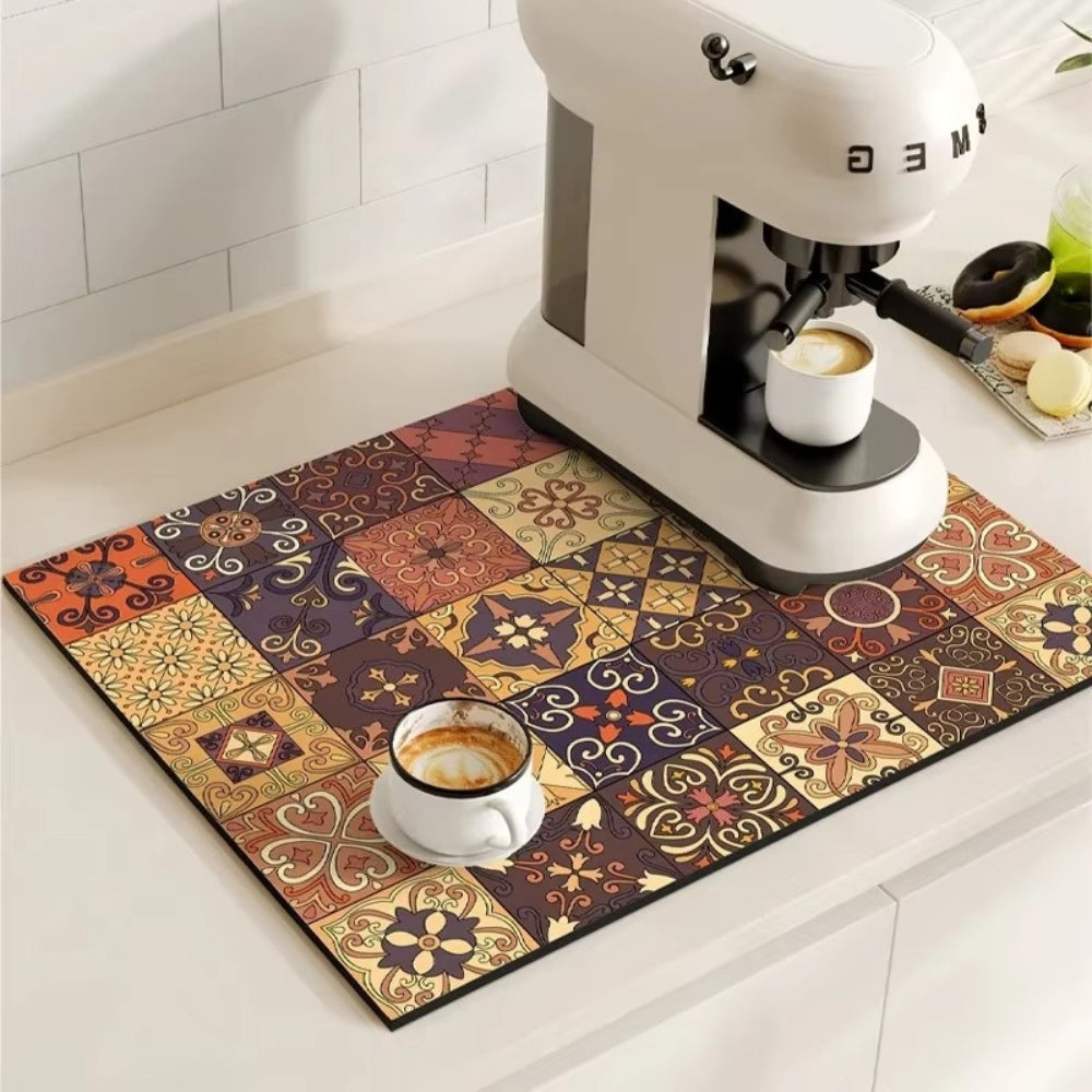 Colorful patterned mat with a coffee cup and espresso machine on a kitchen counter.