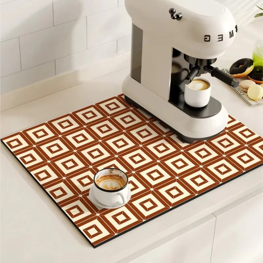 Patterned mat with coffee cups and a mixer on a kitchen counter