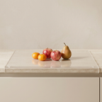 Clear acrylic tray with fruits on a light-colored surface