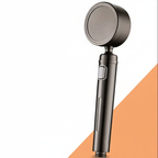 Handheld shower head with a metallic finish on a white and orange background