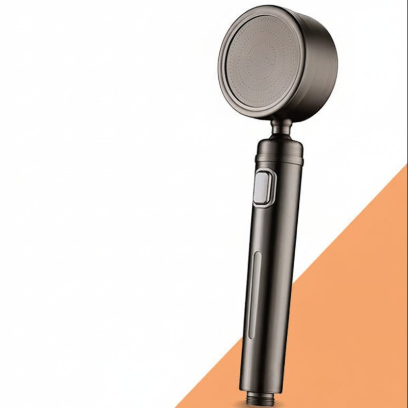 Handheld shower head with a metallic finish on a white and orange background