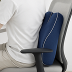 Person using a blue ergonomic pillow on a chair for back support.