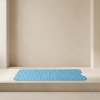 Blue bath mat on a beige bathtub ledge