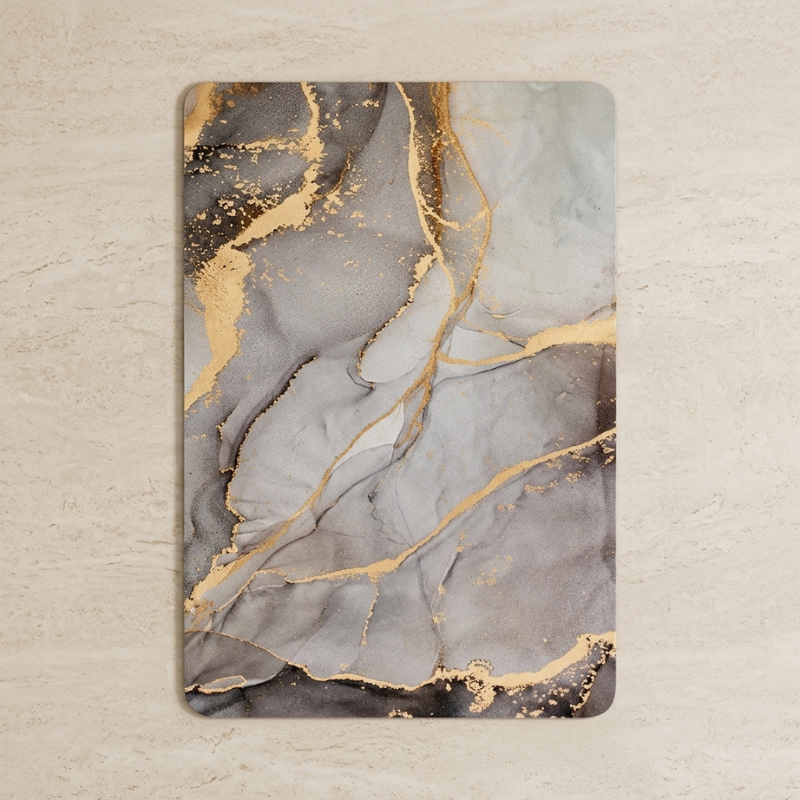 Decorative mat with marble-like design featuring gold accents on a beige background