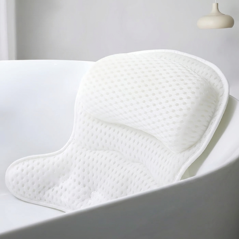 White bath pillow in a bathtub with a neutral background