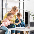 Woman reading a book to two children with a portable air conditioner in the foreground.