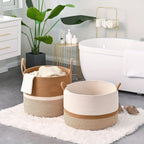Two woven baskets in a bathroom setting with a bathtub and plant.