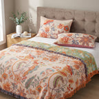 Bedroom with floral bedding and pillows on a bed