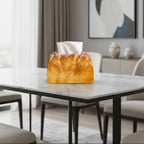 Loaf-shaped tissue box on a marble table in a modern living room.