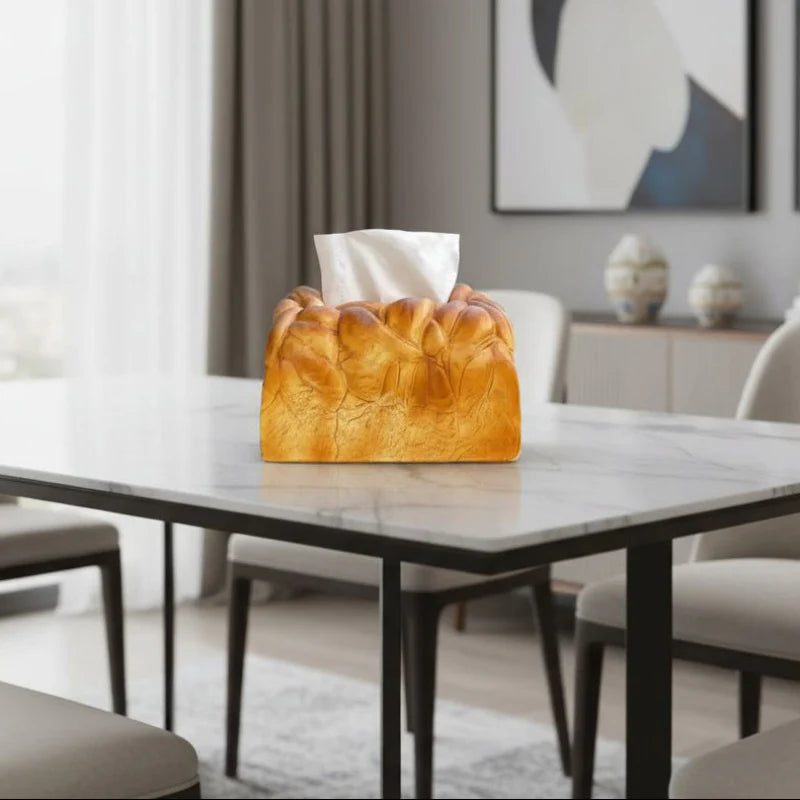 Loaf-shaped tissue box on a marble table in a modern living room.