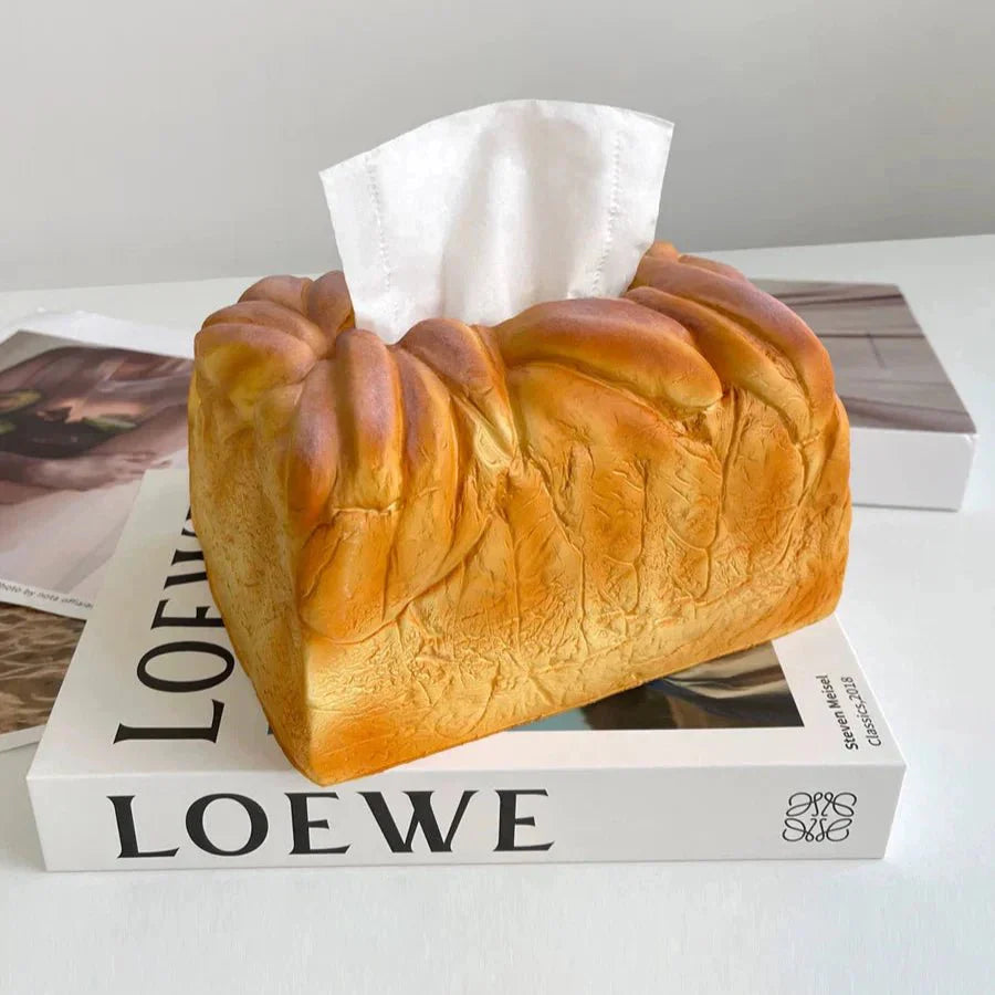 Bread-shaped tissue box on a book
