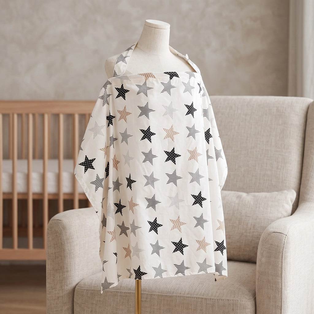 A baby nursing or changing wrap with an all-over star pattern, displayed on a mannequin torso sitting on a beige armchair in a nursery setting.