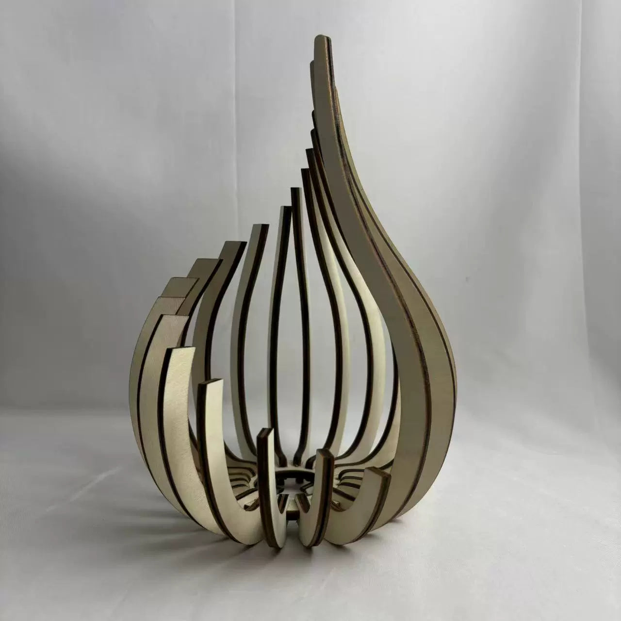Wooden decorative item with a unique design on a white background