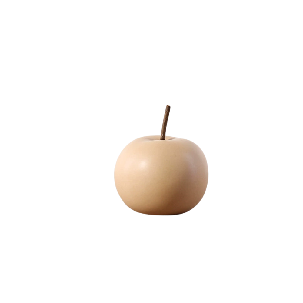 Beige decorative apple on a white background