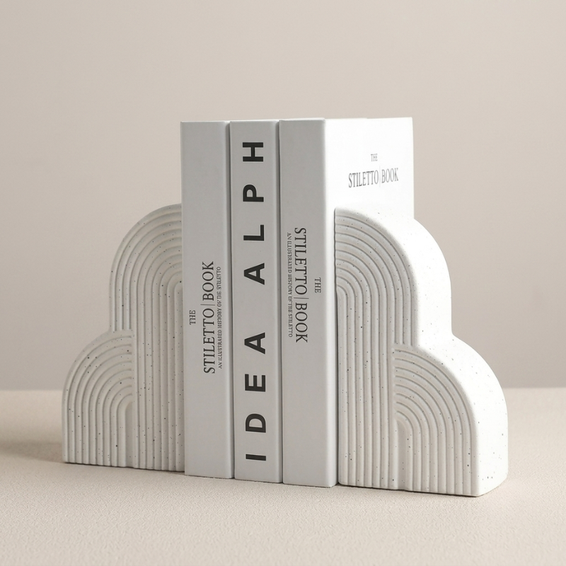 White and gray bookends with 'Idea Alph' branding on a beige background
