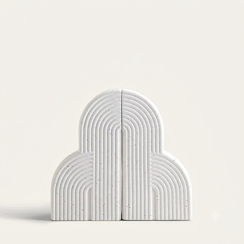 White arch-shaped bookends on a light gray background