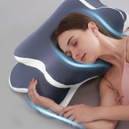 Woman using a blue and white neck pillow on a gray background