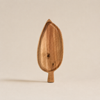 Wooden ice cream scoop on a beige background