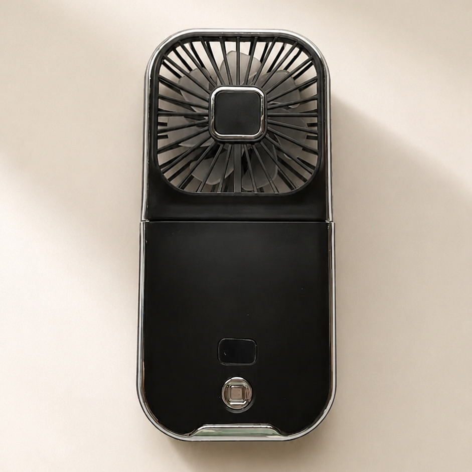 Black handheld fan on a beige background