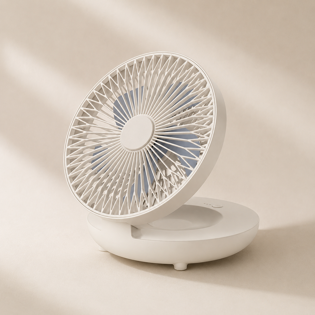 White portable fan on a beige background
